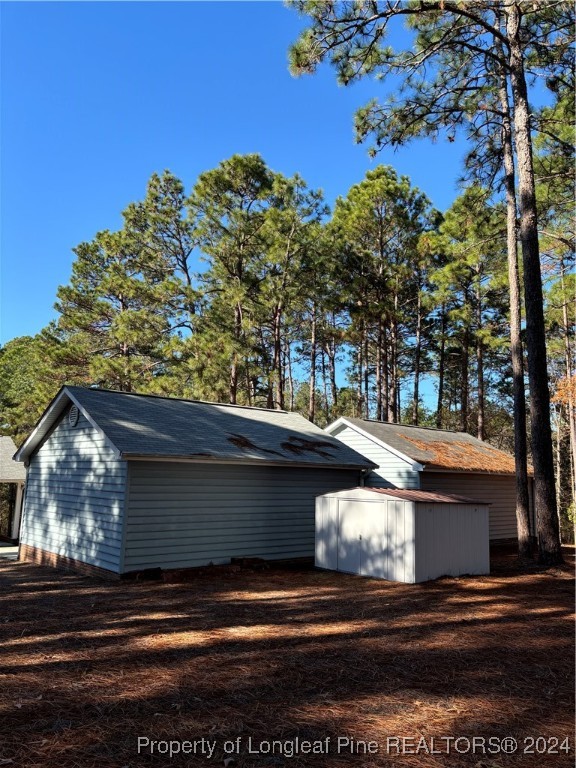 620 Myra Road Raeford, NC 28376 - Photo 30 of 38 a view of house with tree s