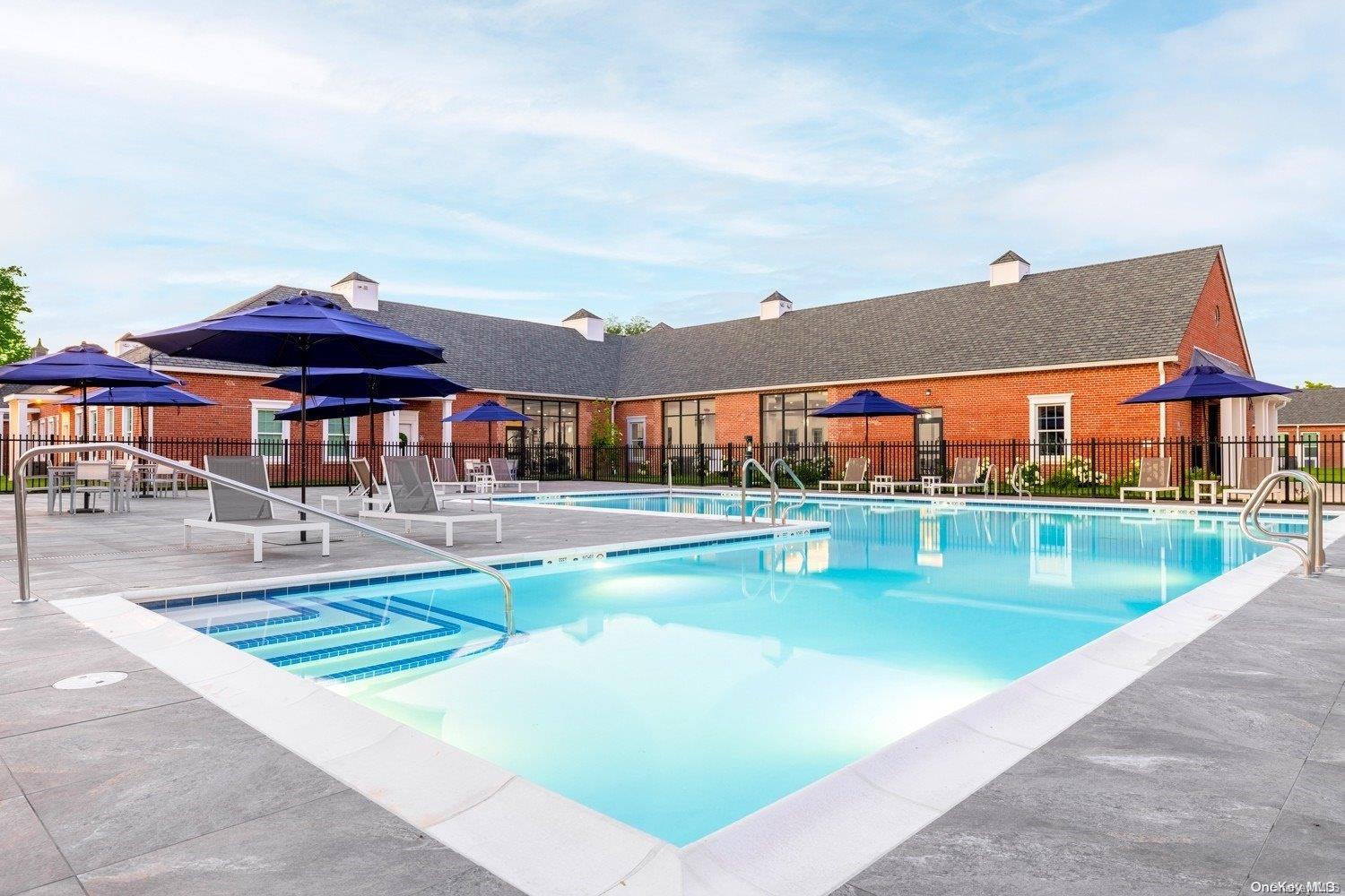 75 Circle Drive, Unit 89104 Central Islip, NY 11722 - Photo 1 of 1 swimming pool view with a seating space