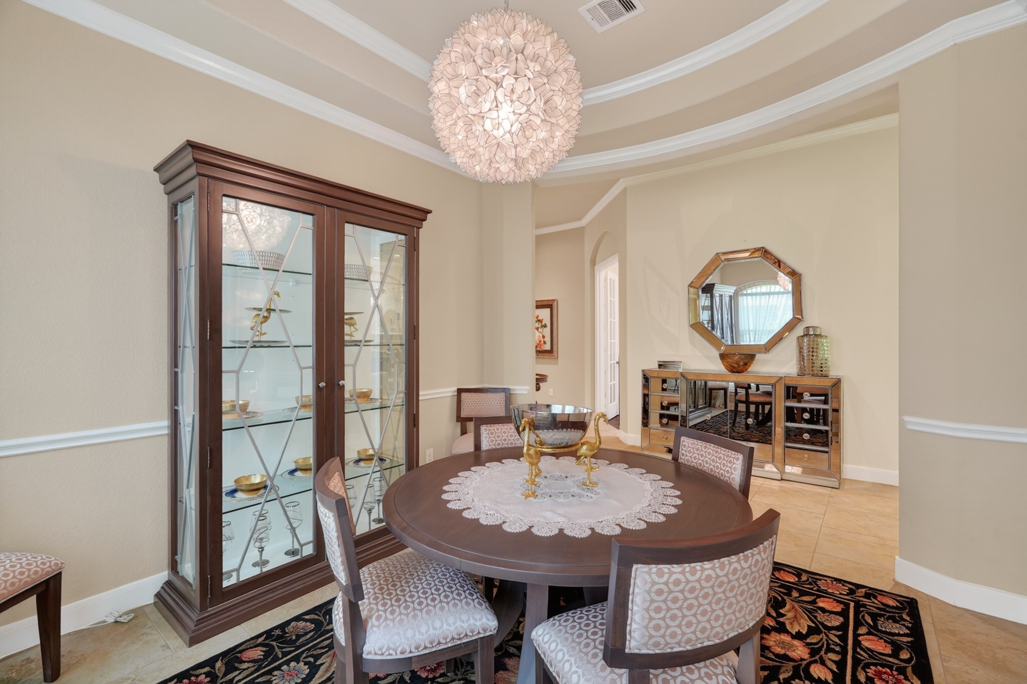 55 South Victoriana Circle Spring, TX 77389 - Photo 12 of 40 a view of a dining room with furniture a chandelier and wooden floor