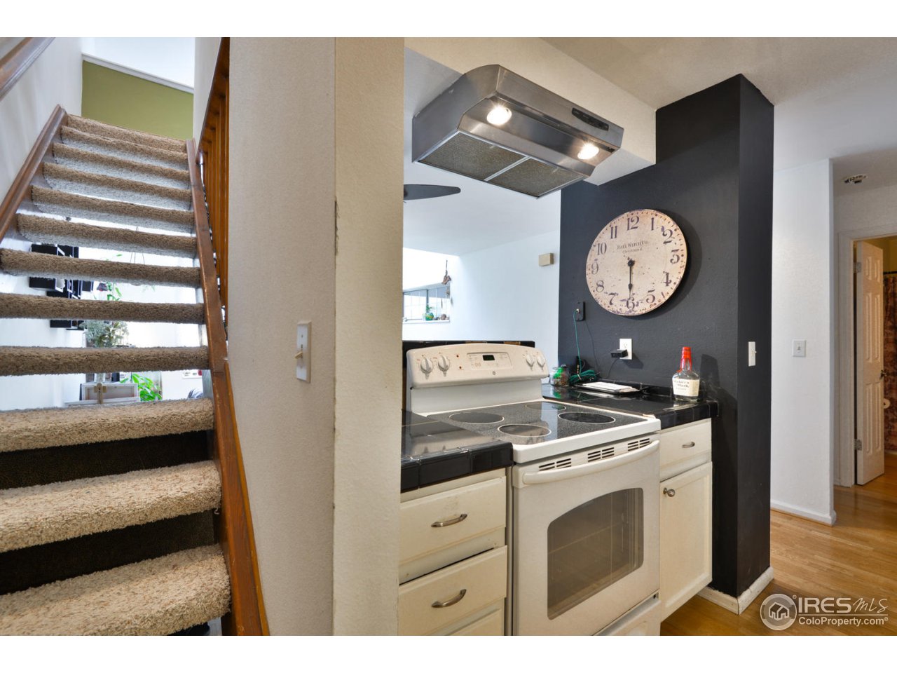 1601 West Swallow Road, Unit J Fort Collins, CO 80526 - Photo 8 of 21 Kitchen & Stairs to loft