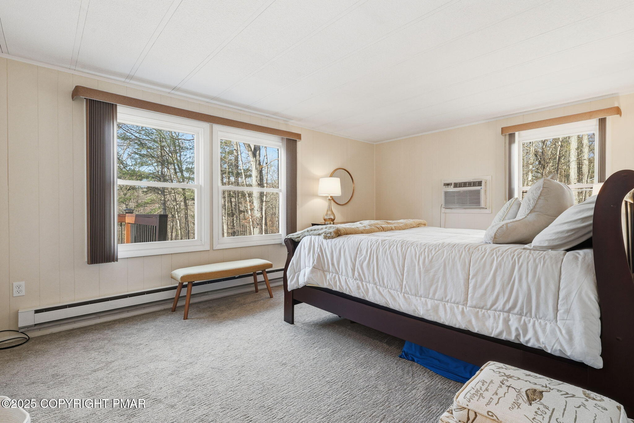 364 Welcome Lake Road Beach Lake, PA 18405 - Photo 11 of 46 a bed sitting in a bedroom next to a window