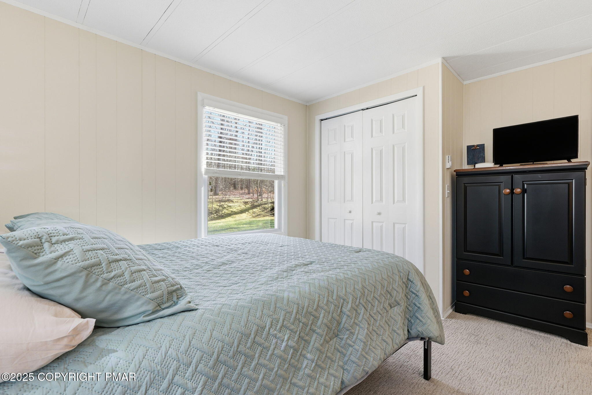 364 Welcome Lake Road Beach Lake, PA 18405 - Photo 17 of 46 a bedroom with a bed and flat screen tv