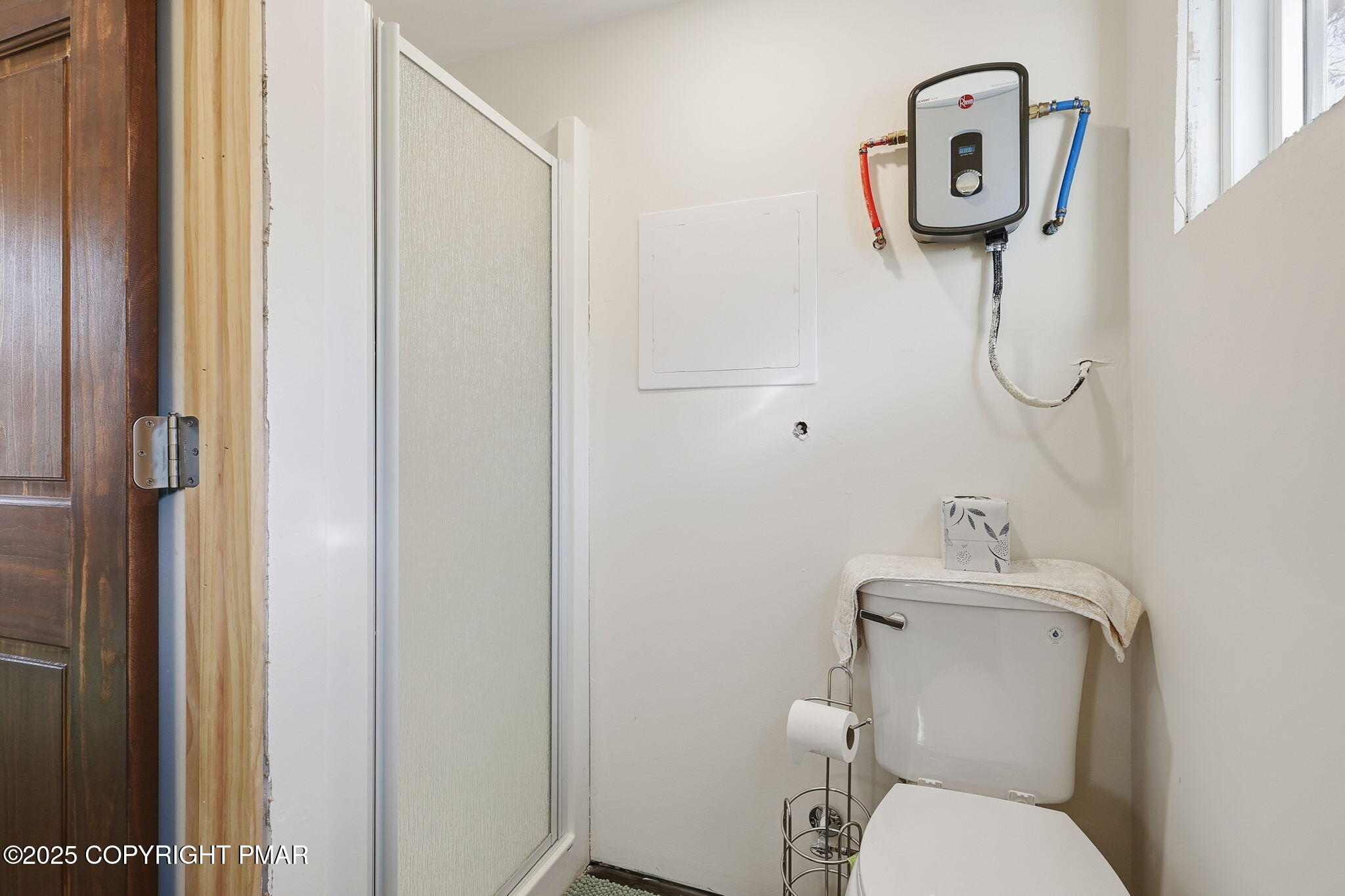 364 Welcome Lake Road Beach Lake, PA 18405 - Photo 24 of 46 a bathroom with a toilet and a shower curtain