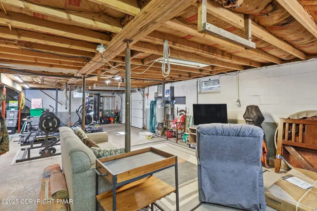 a work room with furniture and a rug