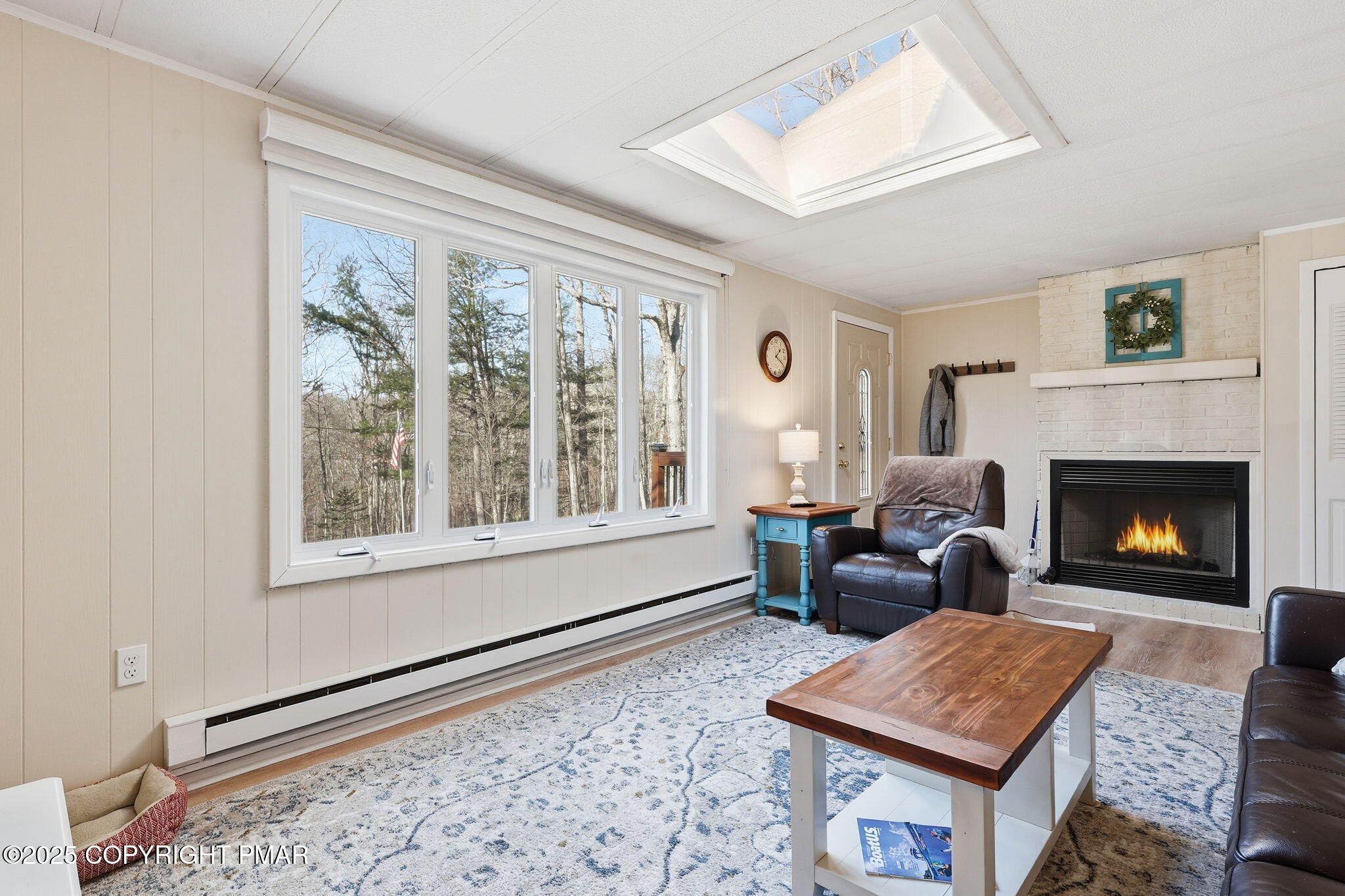 364 Welcome Lake Road Beach Lake, PA 18405 - Photo 4 of 46 a living room with furniture and a fireplace