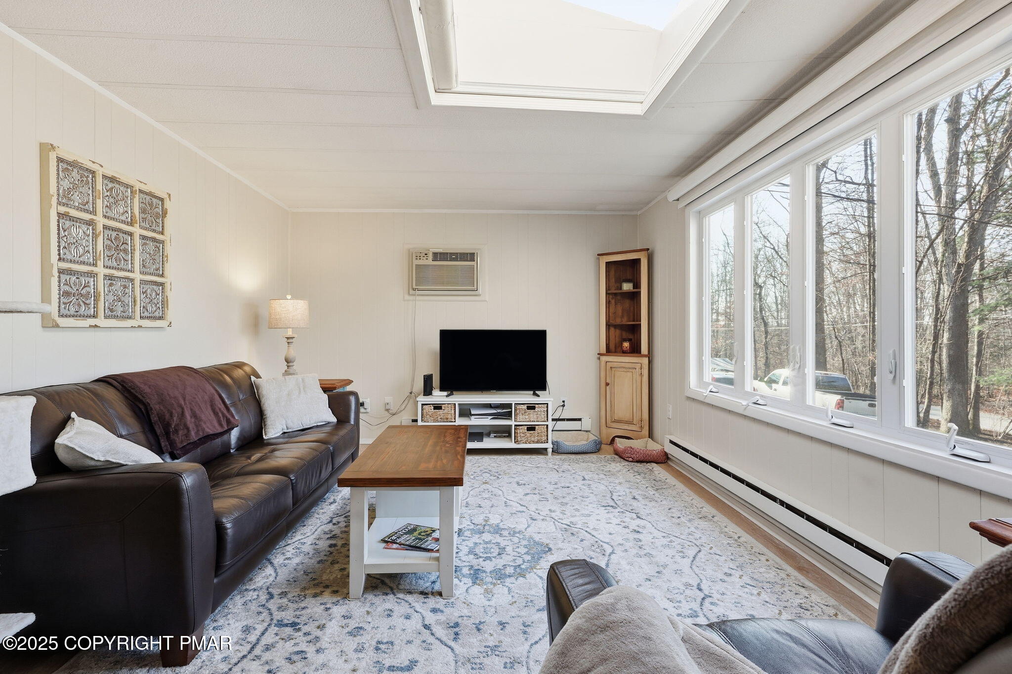 364 Welcome Lake Road Beach Lake, PA 18405 - Photo 6 of 46 a living room with furniture and a flat screen tv