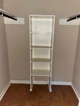 a view of an empty walk in closet