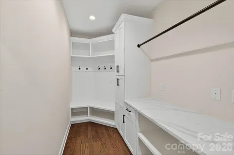 a view of walk in closet with empty racks