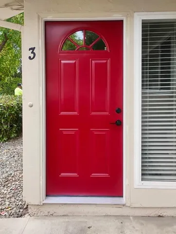 a view of a red door of the house