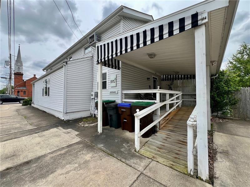 951 Buffalo Street Franklin, PA 16323 - Photo 2 of 31 a view of a house with a wooden deck
