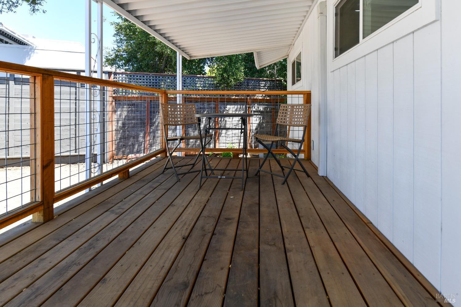 541 Mason Street, Unit 8 Healdsburg, CA 95448 - Photo 18 of 24 a view of balcony with wooden floor and outdoor seating