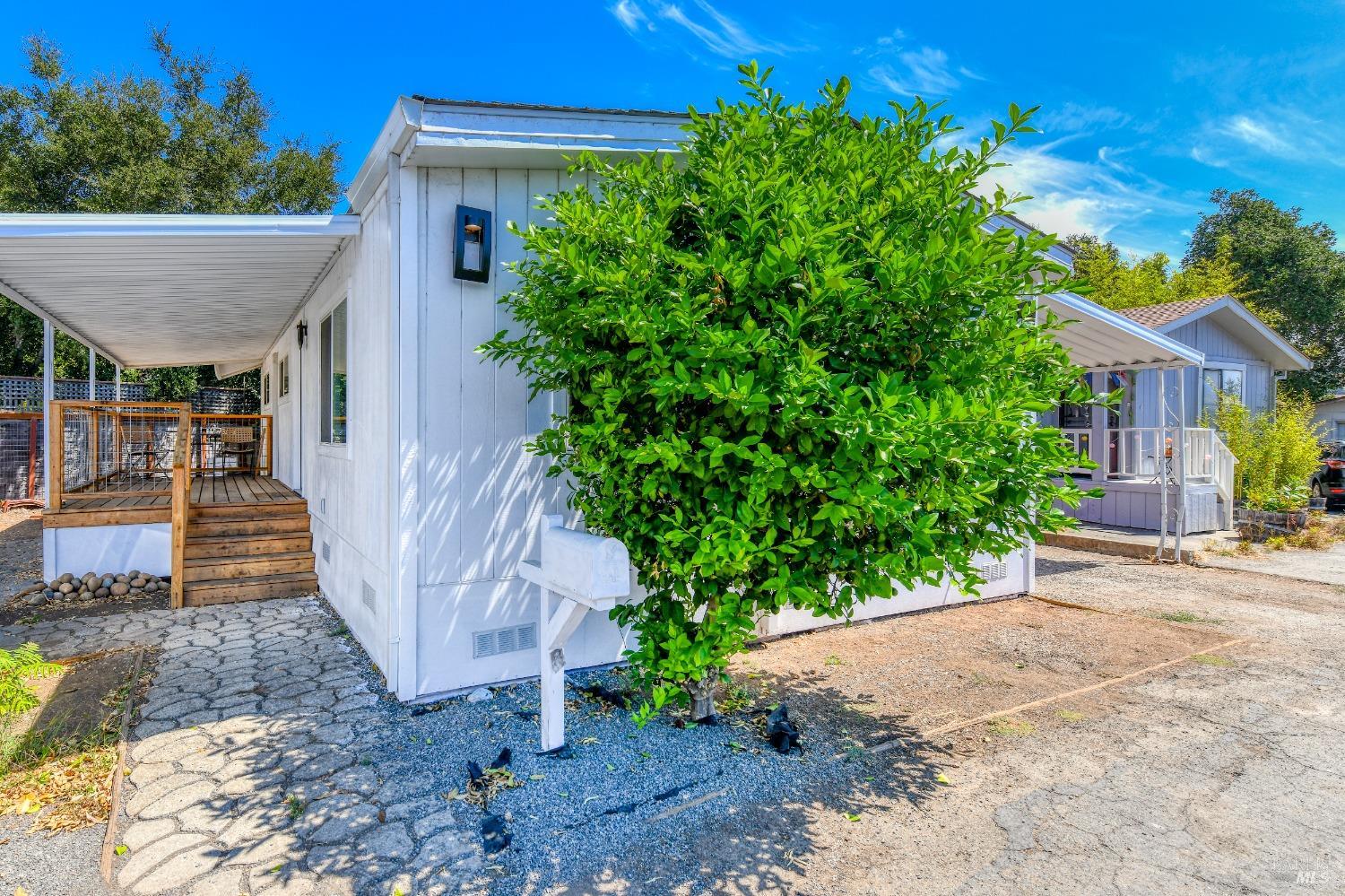 541 Mason Street, Unit 8 Healdsburg, CA 95448 - Photo 2 of 24 a front view of a house with a yard