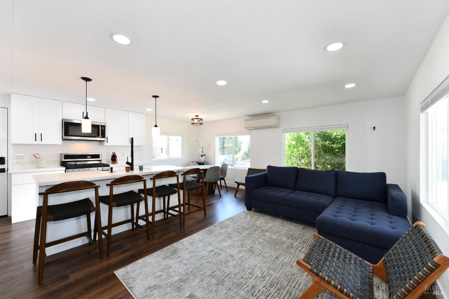 541 Mason Street, Unit 8 Healdsburg, CA 95448 - Photo 3 of 24 a living room with furniture and a wooden floor