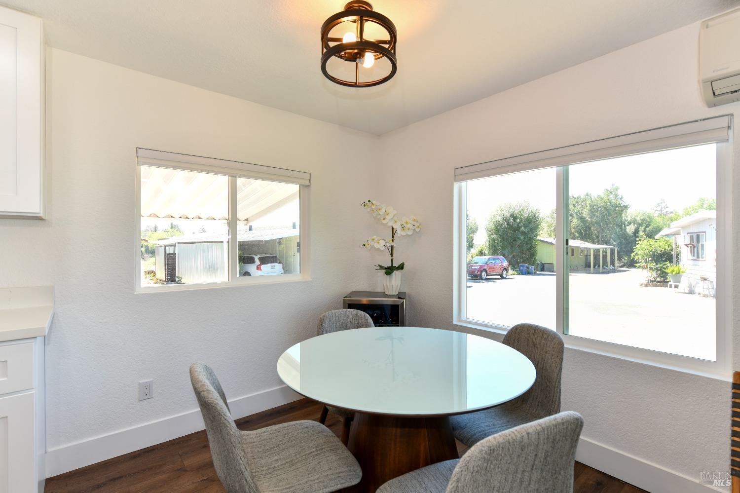 541 Mason Street, Unit 8 Healdsburg, CA 95448 - Photo 8 of 24 a view of a dining room with furniture wooden floor and a window