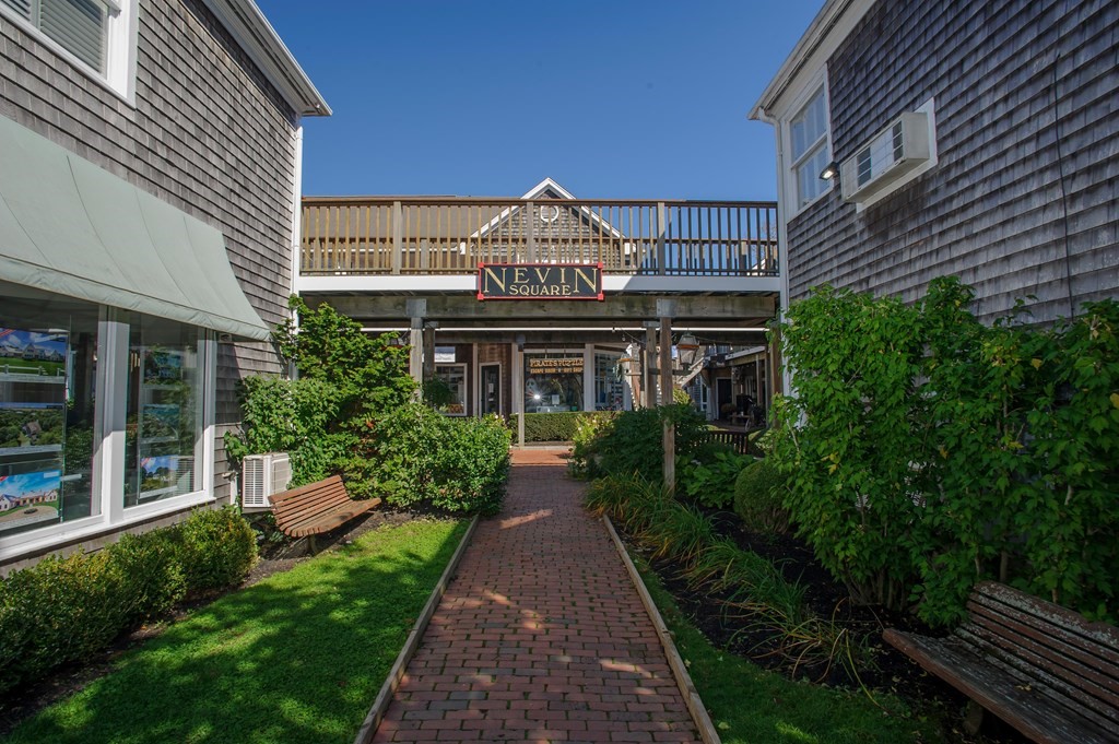 15 Winter Street, Unit 9 Edgartown, MA 02539 - Photo 1 of 13 a front view of a house with garden