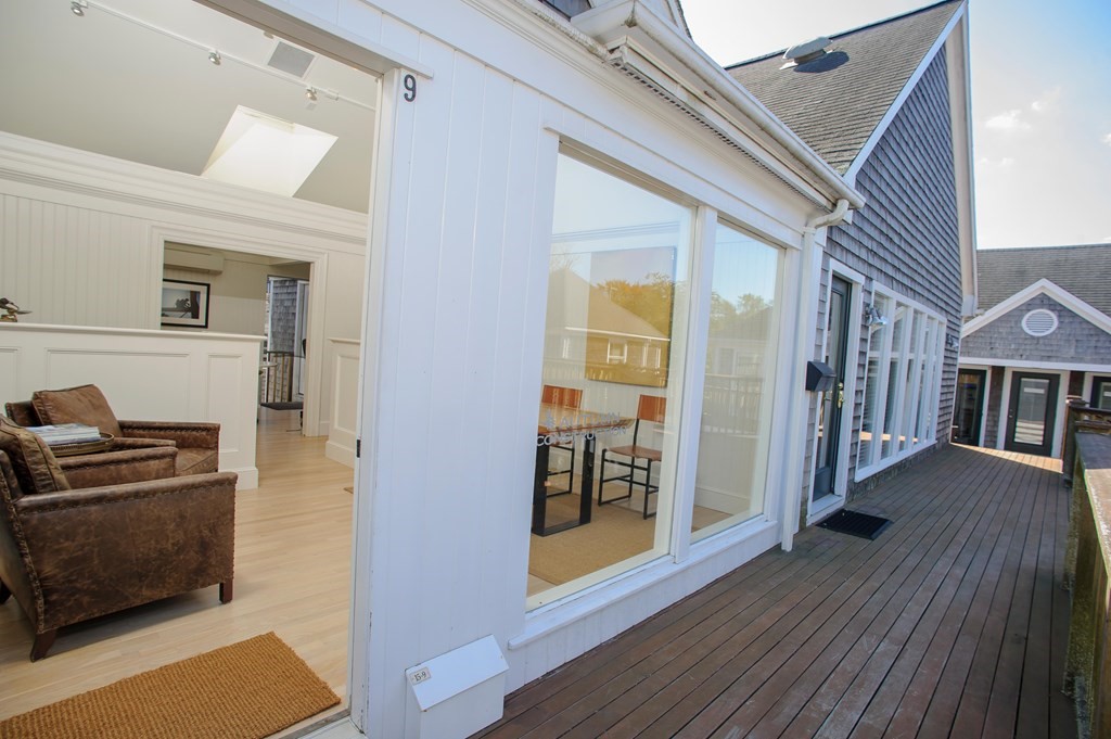 15 Winter Street, Unit 9 Edgartown, MA 02539 - Photo 2 of 13 a view of a livingroom with wooden floor