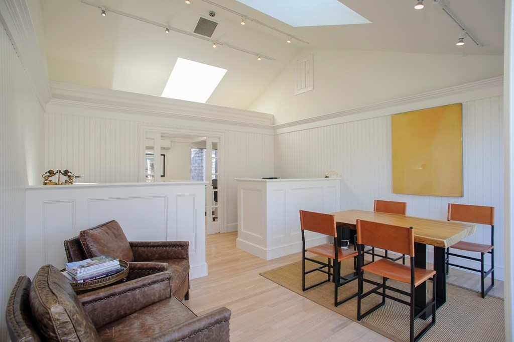 15 Winter Street, Unit 9 Edgartown, MA 02539 - Photo 3 of 13 a living room with furniture and a wooden floor
