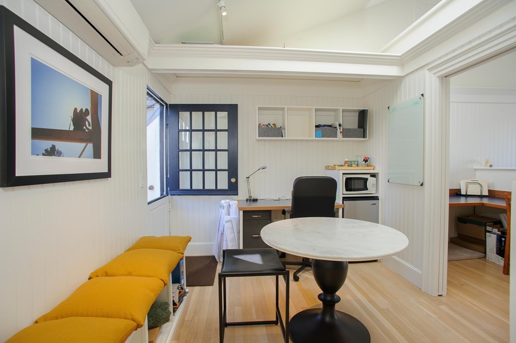 15 Winter Street, Unit 9 Edgartown, MA 02539 - Photo 7 of 13 a room with furniture and wooden floor