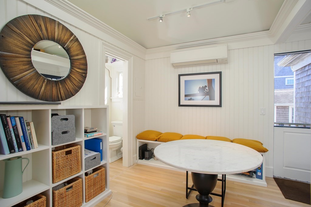 15 Winter Street, Unit 9 Edgartown, MA 02539 - Photo 8 of 13 a living room with furniture and a wooden floor