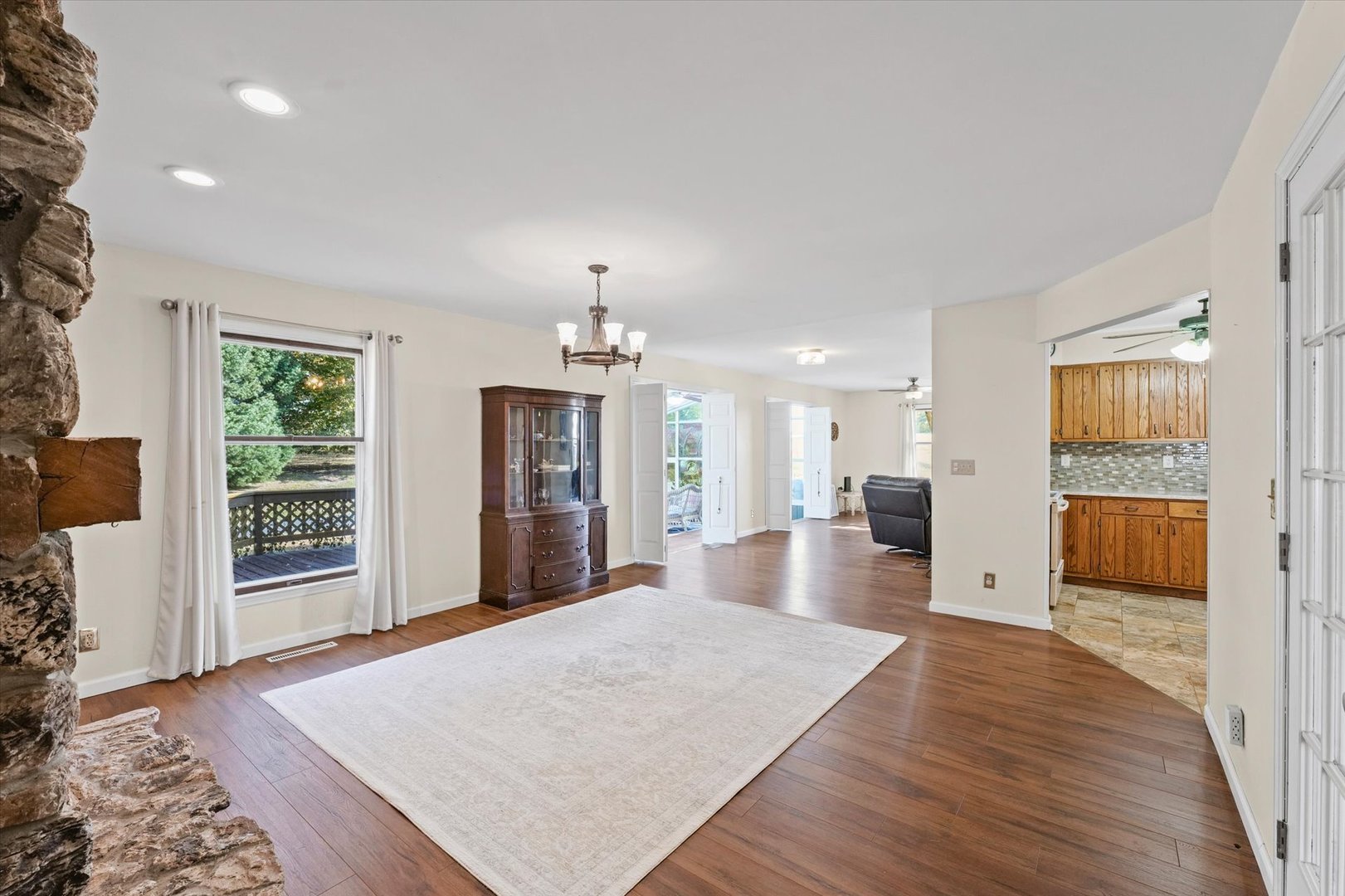 1000 East Kratz Road Monticello, IL 61856 - Photo 12 of 52 a view of a living room and kitchen with wooden floor