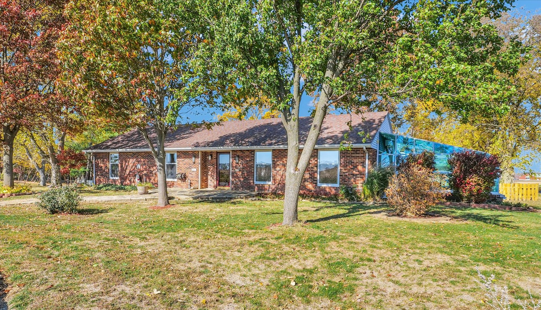 1000 East Kratz Road Monticello, IL 61856 - Photo 2 of 52 a front view of a house with a yard
