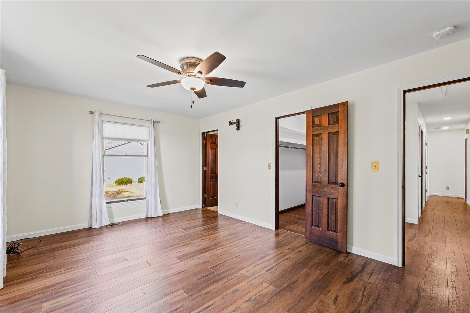 1000 East Kratz Road Monticello, IL 61856 - Photo 23 of 52 a view of an empty room and wooden floor