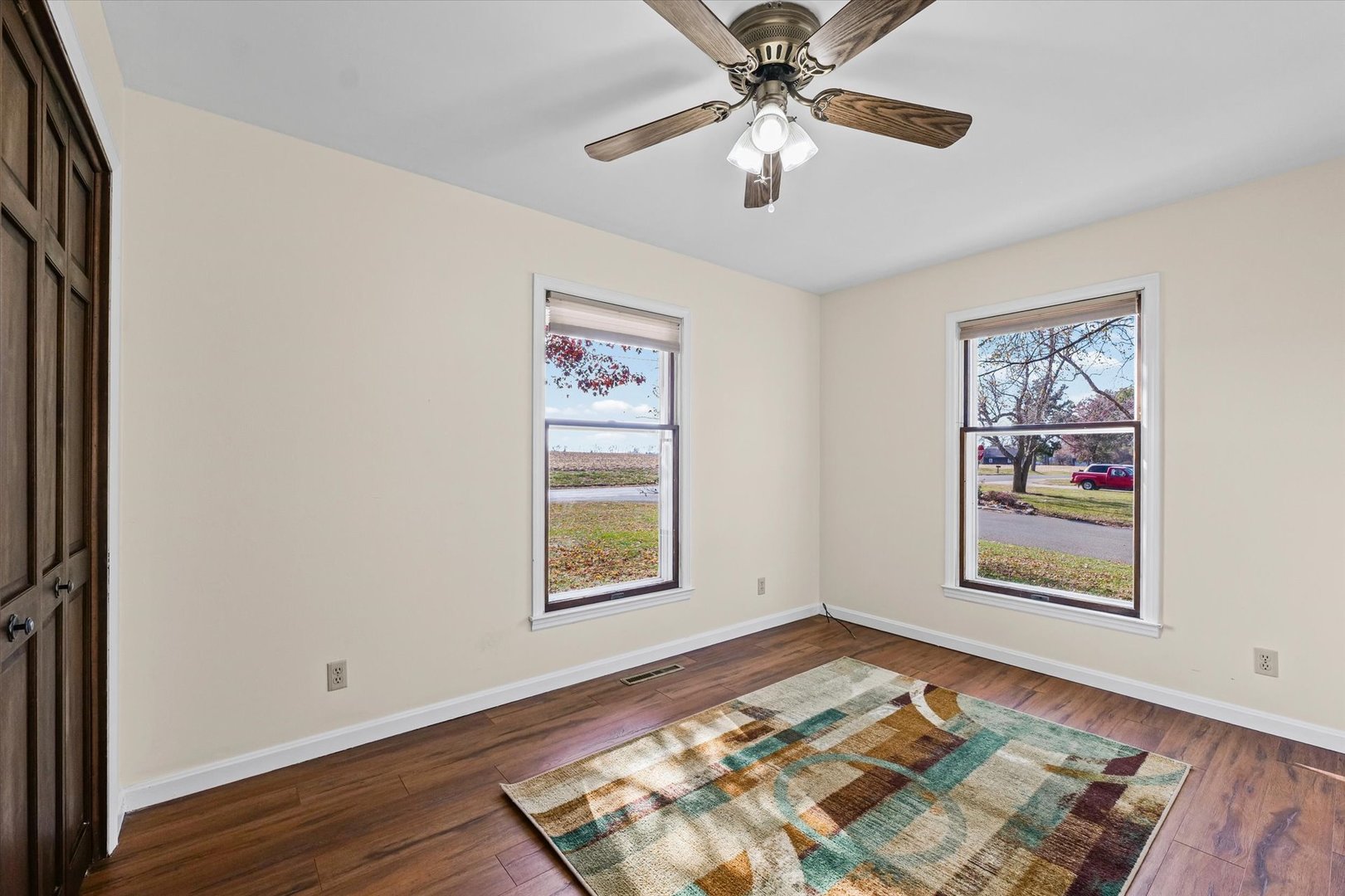 1000 East Kratz Road Monticello, IL 61856 - Photo 27 of 52 a view of an empty room with a window and wooden floor