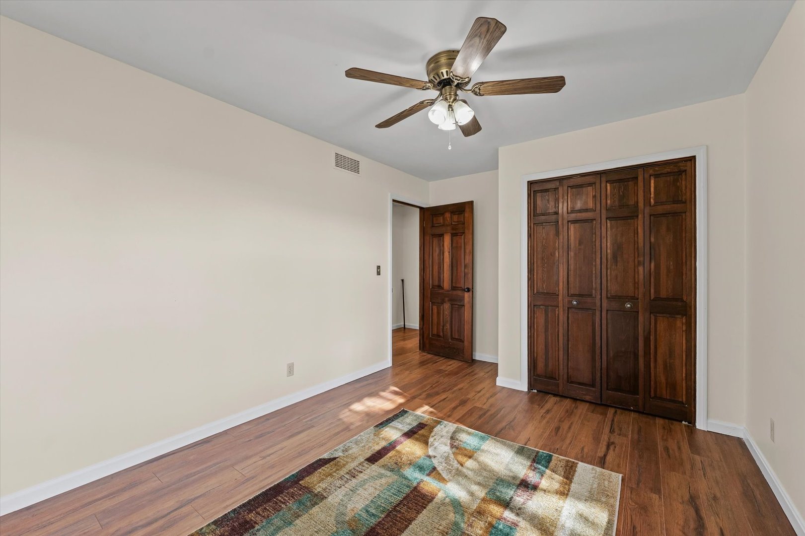 1000 East Kratz Road Monticello, IL 61856 - Photo 28 of 52 a view of an empty room with wooden floor