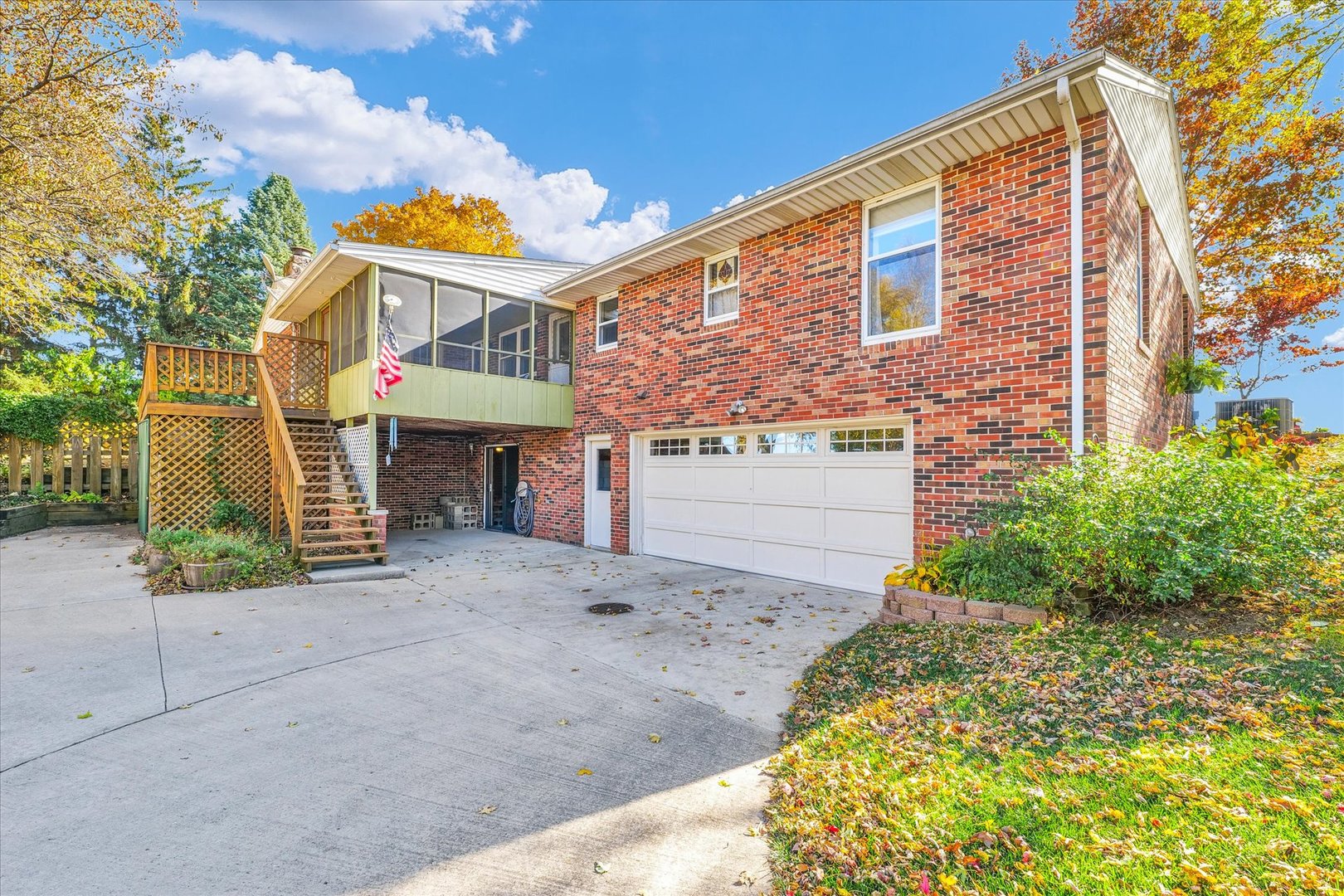1000 East Kratz Road Monticello, IL 61856 - Photo 41 of 52 a front view of a house with a yard and garage