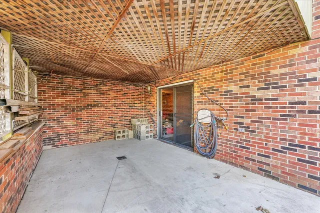 a view of balcony with wooden floor