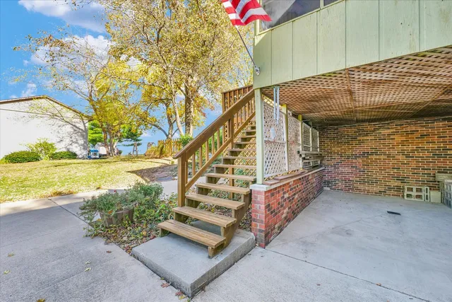 a view of a balcony with wooden floor