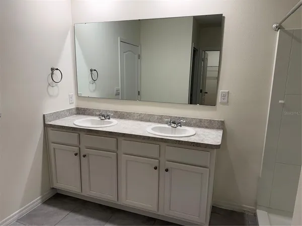 a bathroom with a bathtub and a sink