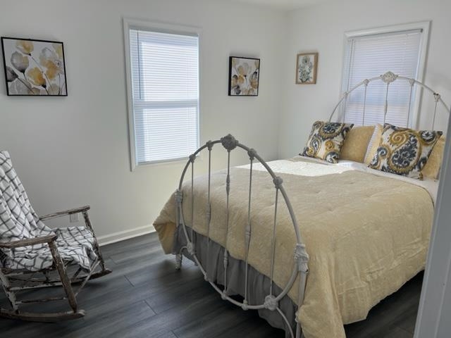 713 West Peebles Road Memphis, TN 38109 - Photo 5 of 7 a bedroom with a bed and wooden floor