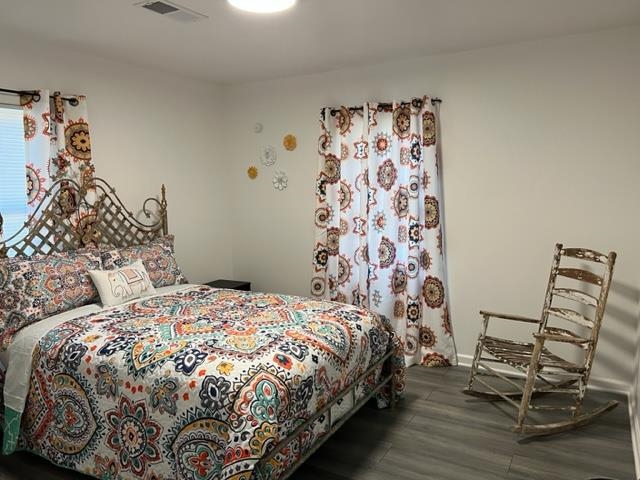 713 West Peebles Road Memphis, TN 38109 - Photo 6 of 7 a bedroom with a bed and chair