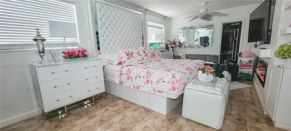 a bed room with a bed and a dresser