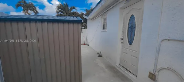 a bathroom with a shower and a sink