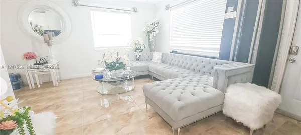 a living room with furniture and a window
