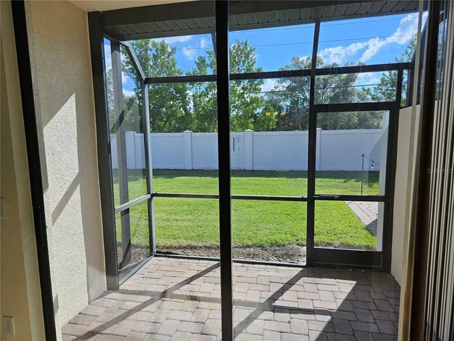 a view of a hallway with a chandelier