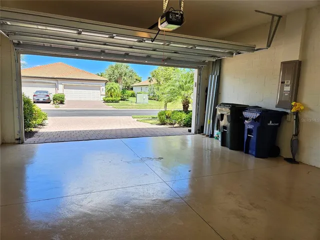 a view of a house with pool and a yard in front of it