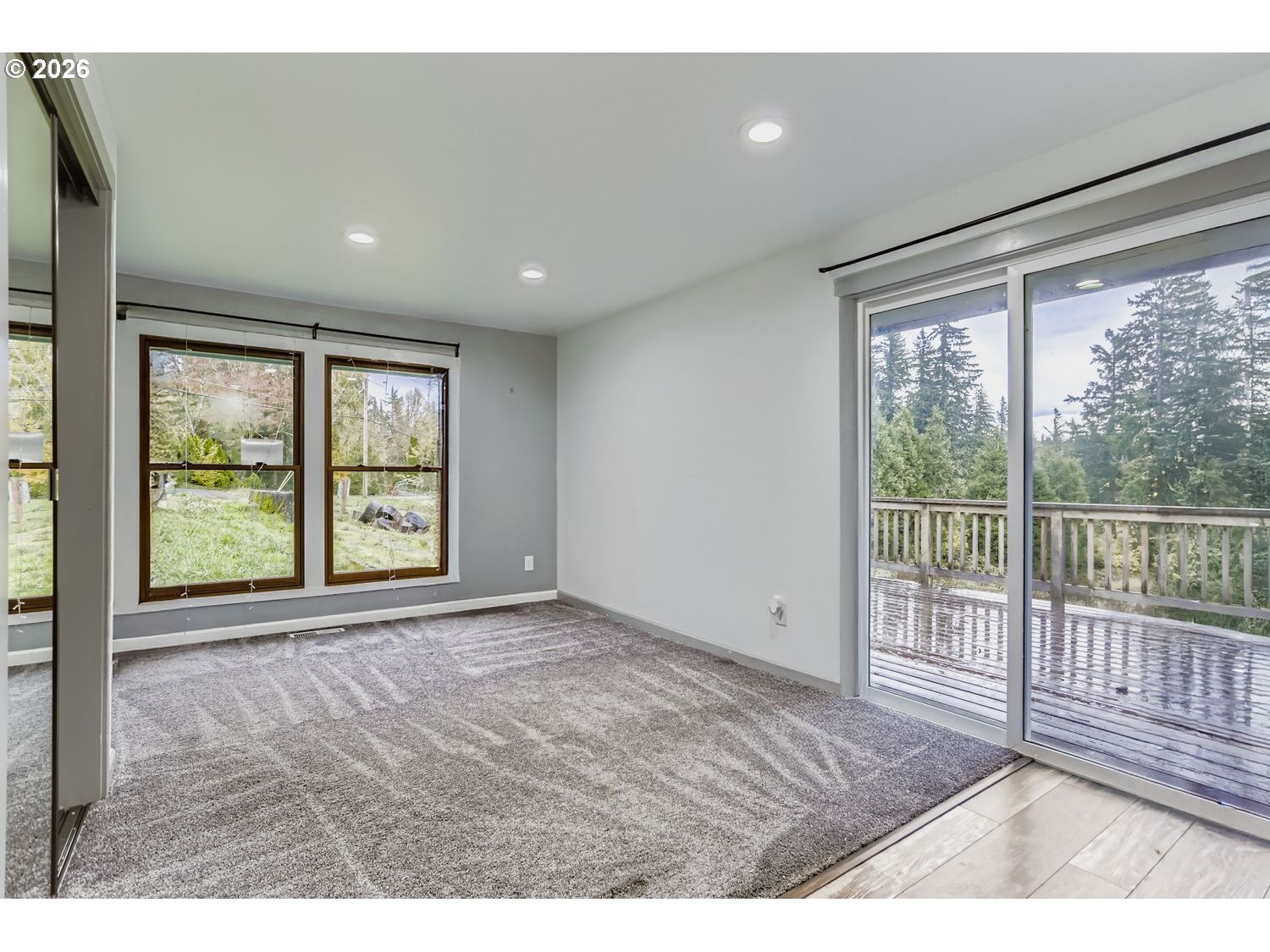 14661 Southeast Royer Road Damascus, OR 97089 - Photo 12 of 40 a view of an empty room with a window