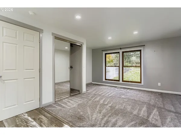 a view of an empty room with a window
