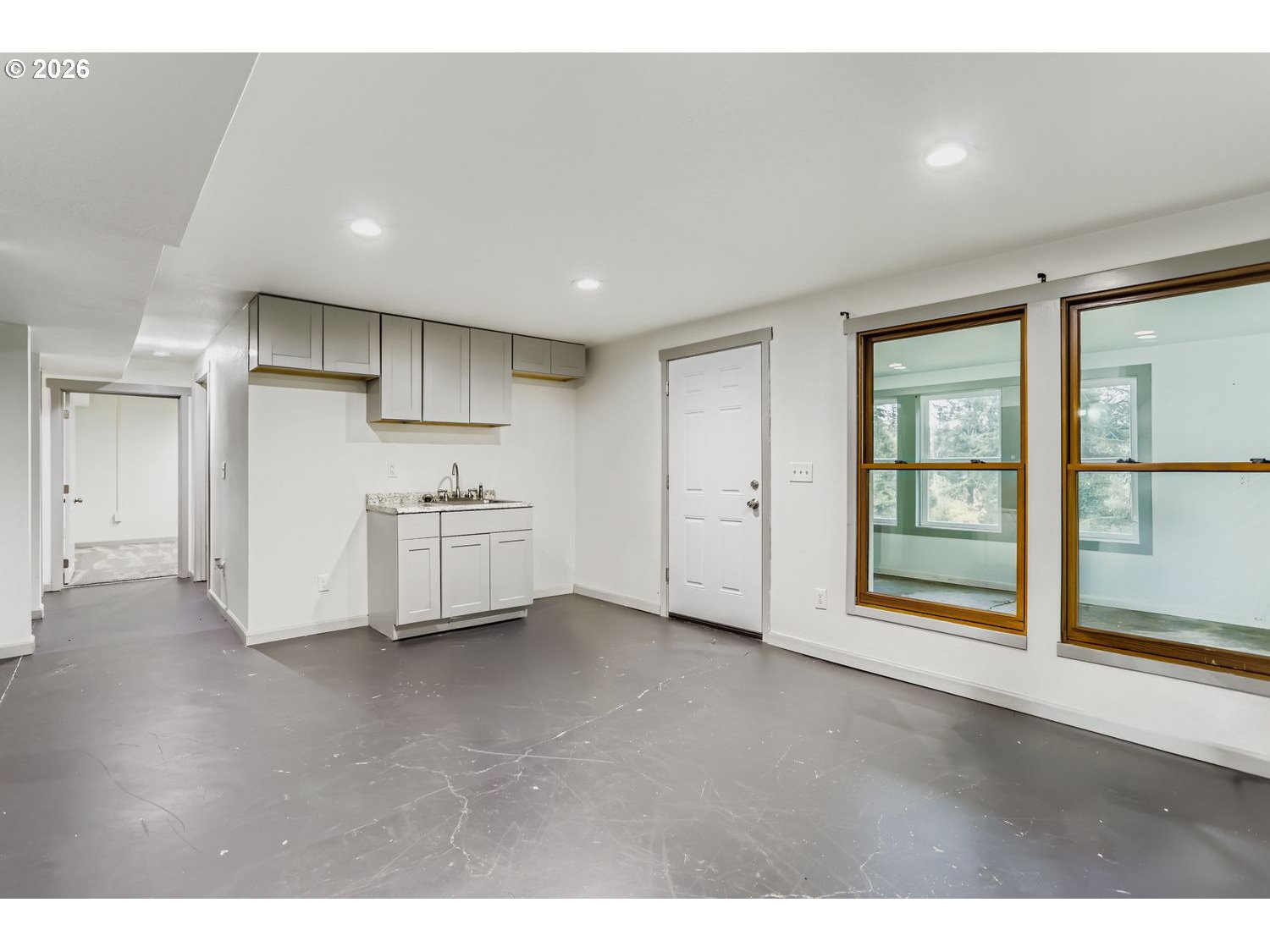 14661 Southeast Royer Road Damascus, OR 97089 - Photo 24 of 40 a view of an empty room with a kitchen