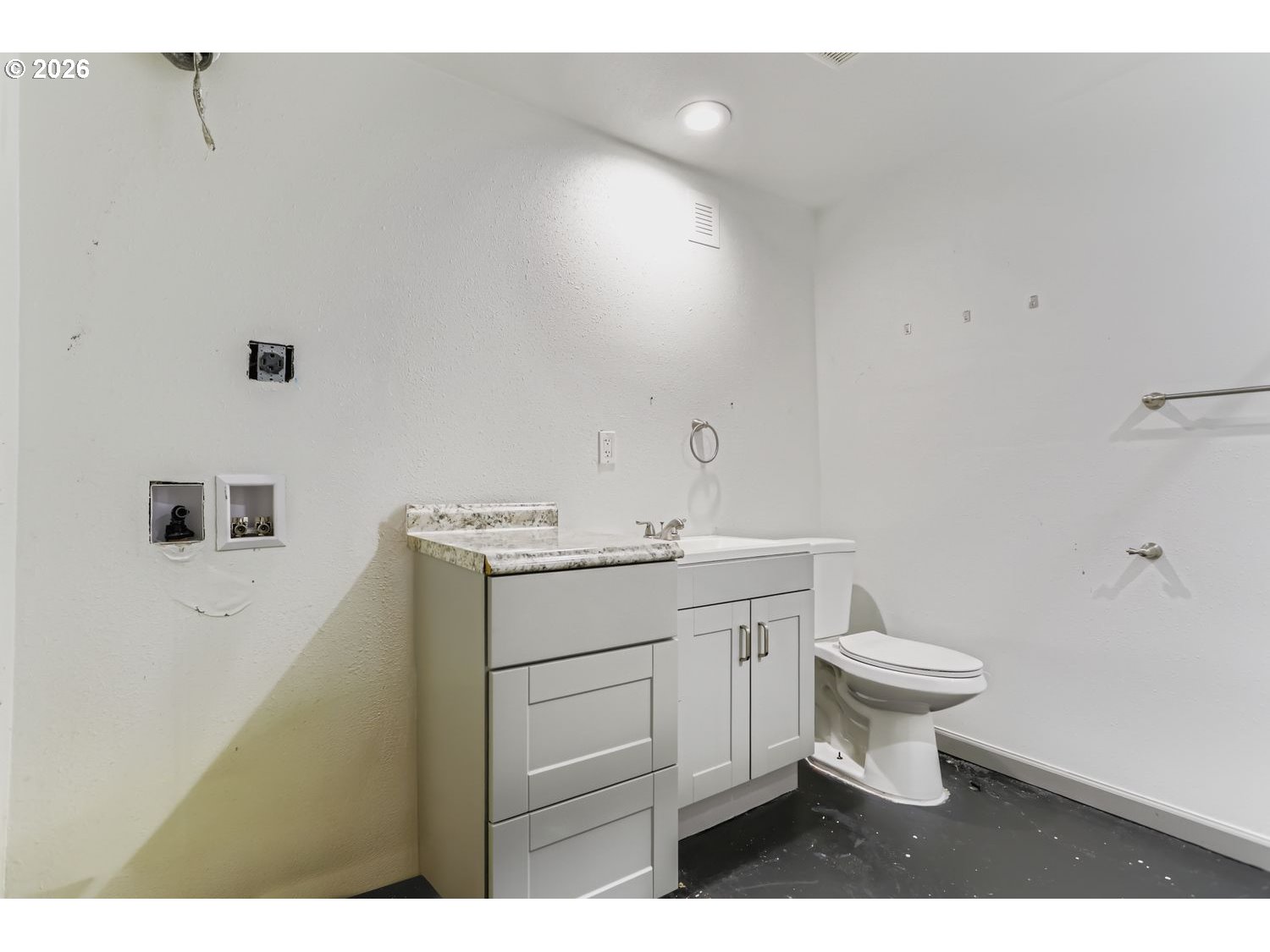 14661 Southeast Royer Road Damascus, OR 97089 - Photo 25 of 40 a bathroom with a sink toilet and vanity