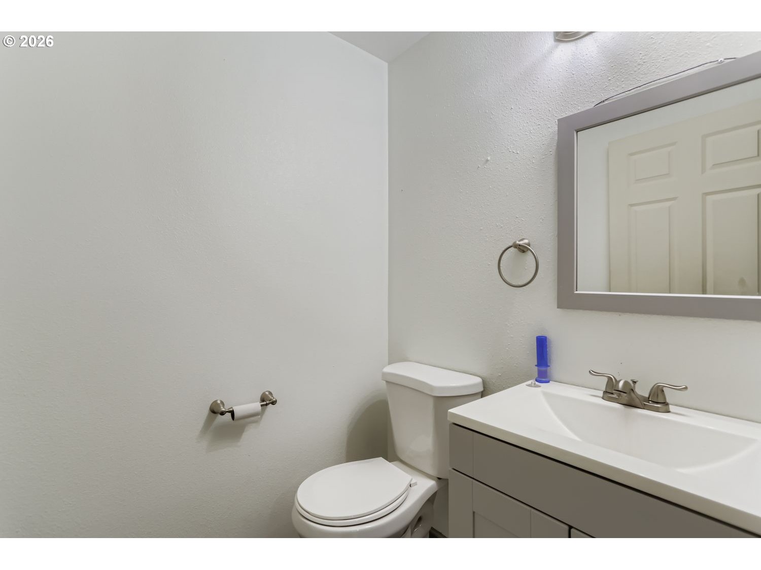 14661 Southeast Royer Road Damascus, OR 97089 - Photo 27 of 40 a bathroom with a sink vanity mirror and toilet