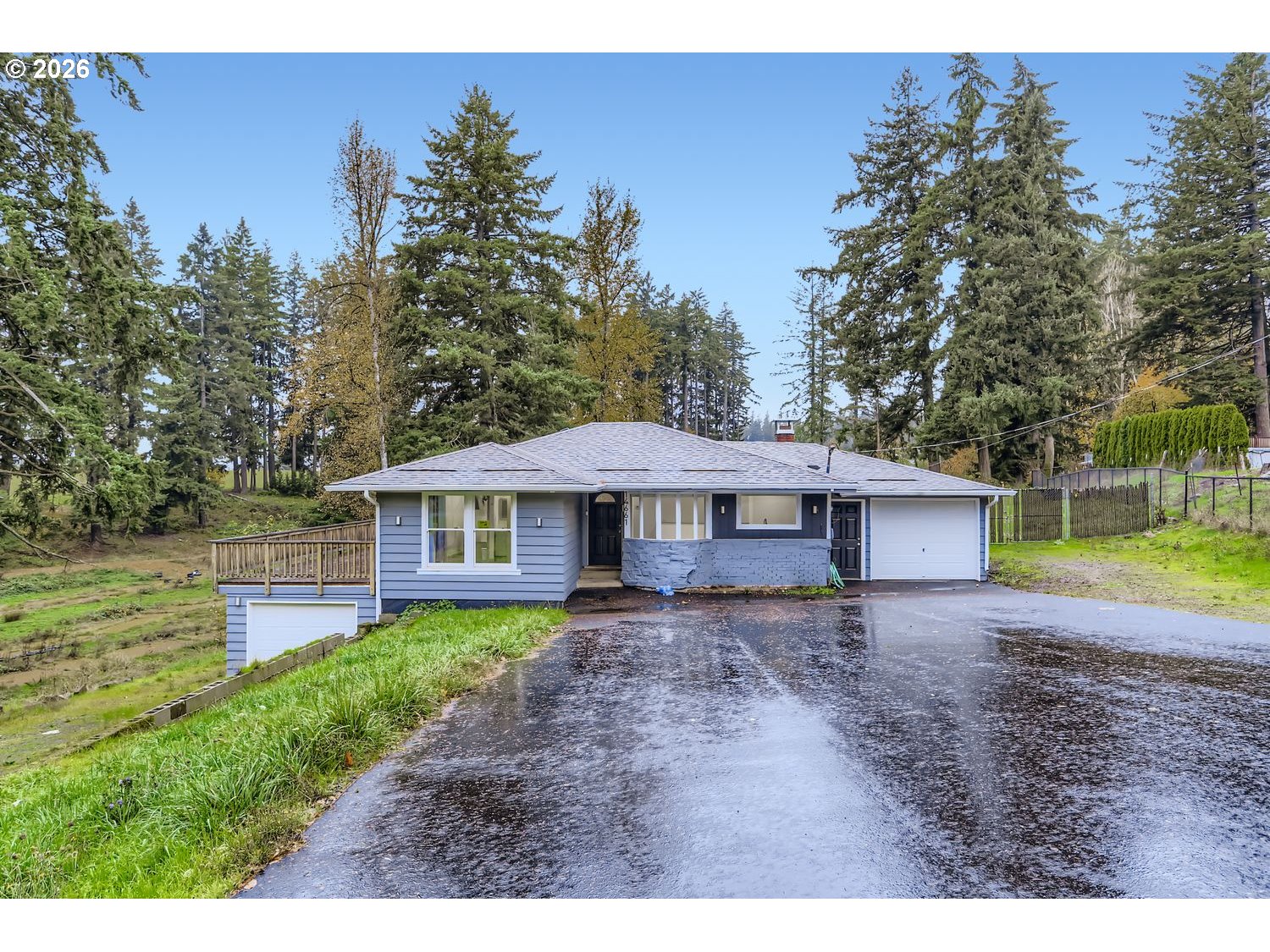 14661 Southeast Royer Road Damascus, OR 97089 - Photo 3 of 40 a front view of a house with garden