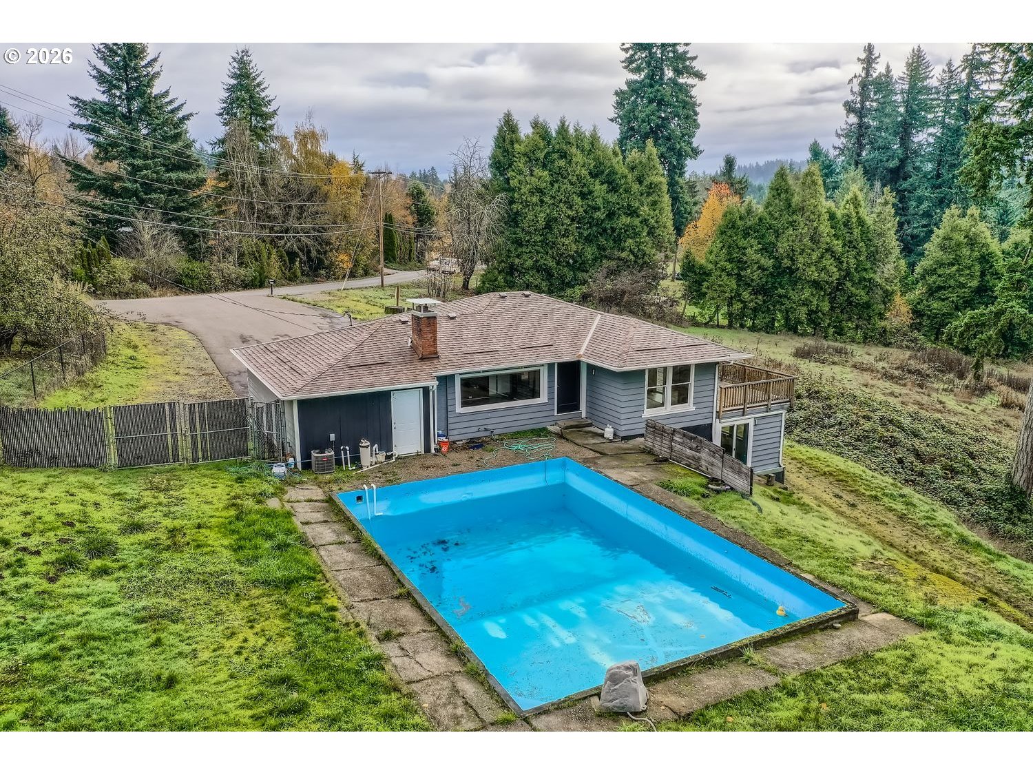 14661 Southeast Royer Road Damascus, OR 97089 - Photo 33 of 40 a view of a house with pool and chairs