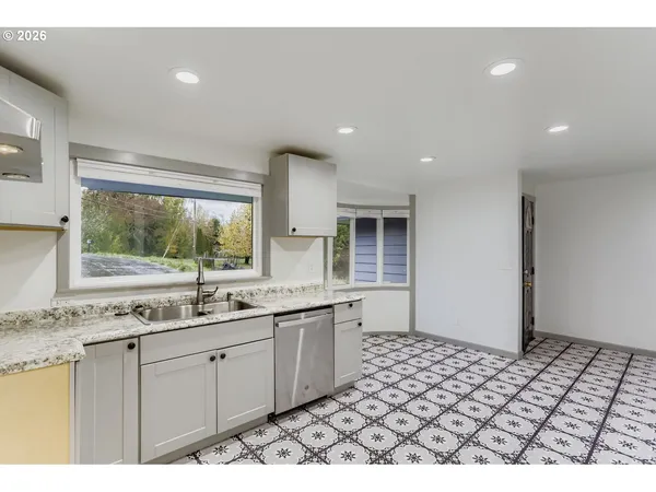 a kitchen with a sink and a window