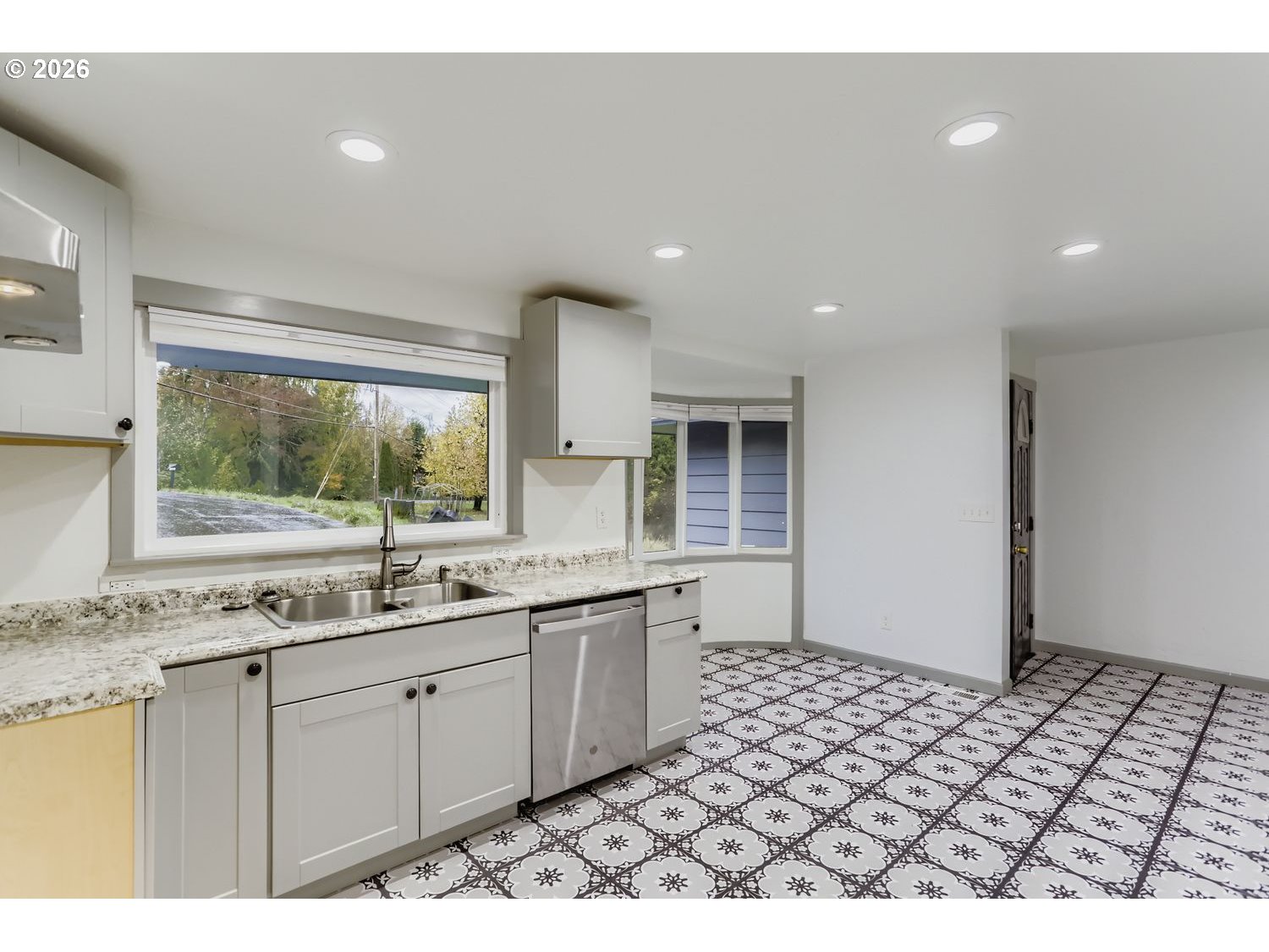 14661 Southeast Royer Road Damascus, OR 97089 - Photo 5 of 40 a kitchen with a sink and a window
