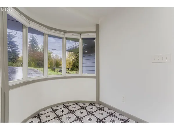 a view of an empty room and window