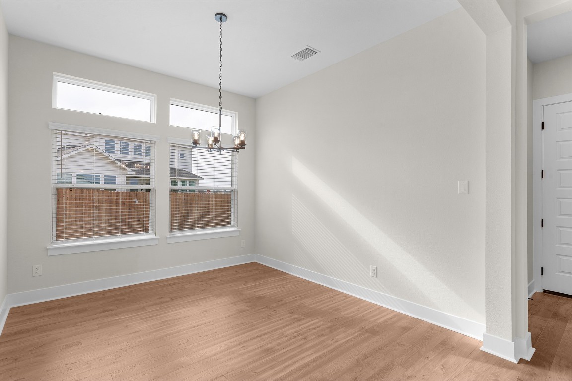 19513 Domino Champ Road Pflugerville, TX 78660 - Photo 11 of 28 a view of an empty room with a window